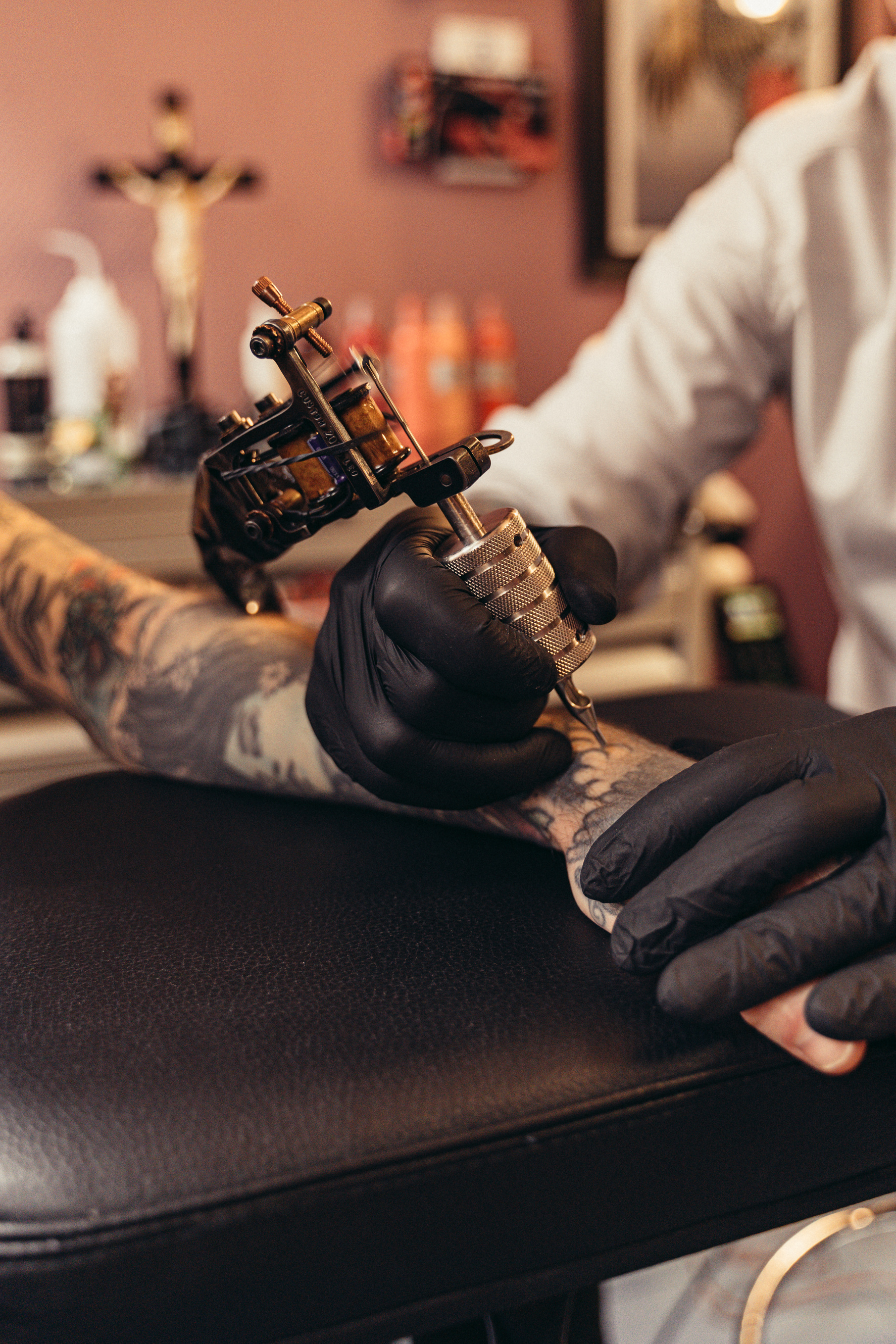 Close-up Photo of a Tattoo Artist Tattooing a Client